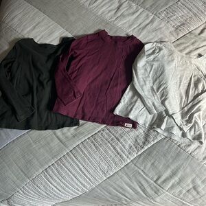 3 long sleeve shirts. Purple is gap, 2 others are old navy.